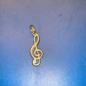 Silver music note pendant.